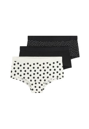 Tre par dames hipster undertøj i sort og hvid, to ensfarvede sorte med forskellige størrelser af hvide polkaprikker, én hvid med store sorte prikker.