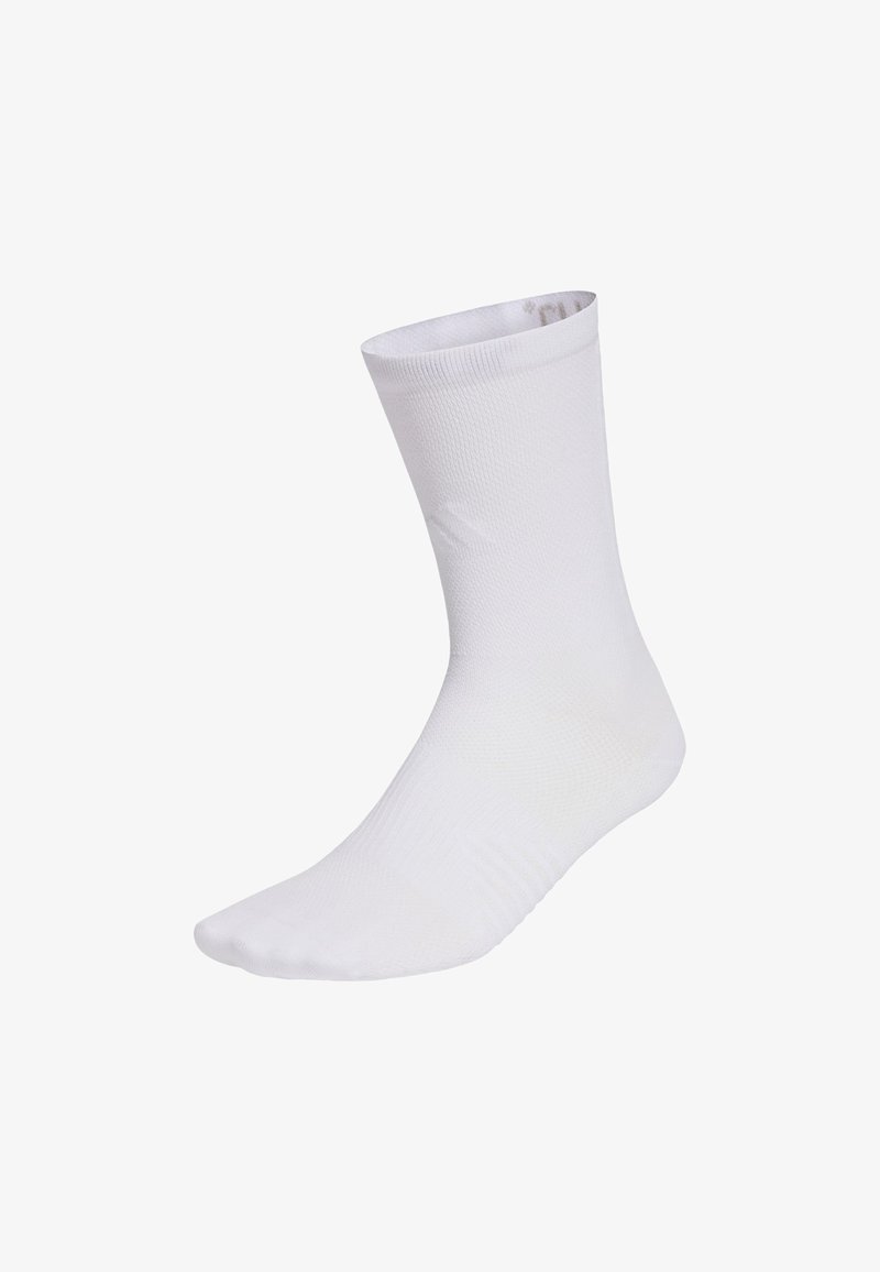 Chaussette de sport blanche avec une finition lisse et texturée. Elle présente une longueur mi-mollet et un bout renforcé. Aucun motif ou accent visible.