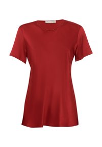 T-shirt rosso a maniche corte realizzato in tessuto morbido. Presenta un colletto rotondo e una vestibilità rilassata, con orlo dritto e senza decorazioni visibili.