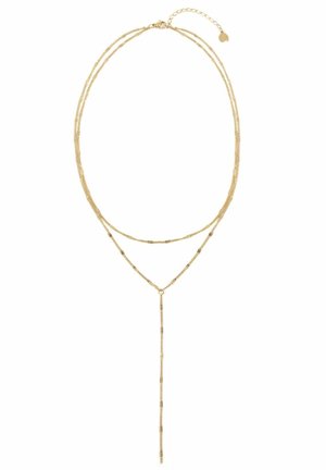 Collier délicat en or superposé avec deux fines chaînes, une courte et une plus longue avec un pendentif goutte verticale.
