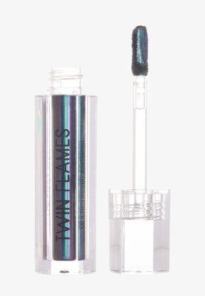Pigment multichrome in un tubo trasparente, con sfumature iridescenti di viola, verde e blu. Applicatore corto attaccato con una punta soffice.