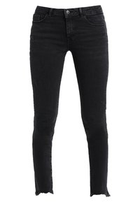 Czarne dżinsy skinny z lekkim wyblakaniem i przetarciami. Posiadają zapięcie na guzik i postrzępiony dół. Klasyczny krój z pięcioma kieszeniami.