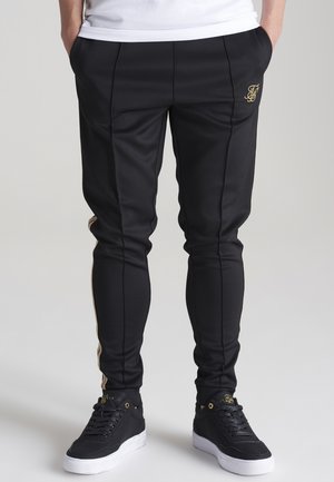 INFINITE PLEATED - Pantaloni sportivi - black & gold
