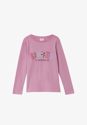 Pink long-sleeve shirt in soft fabric with "CIRCUS" design in colorful letters. The text features animal patterns and a rounded neckline.