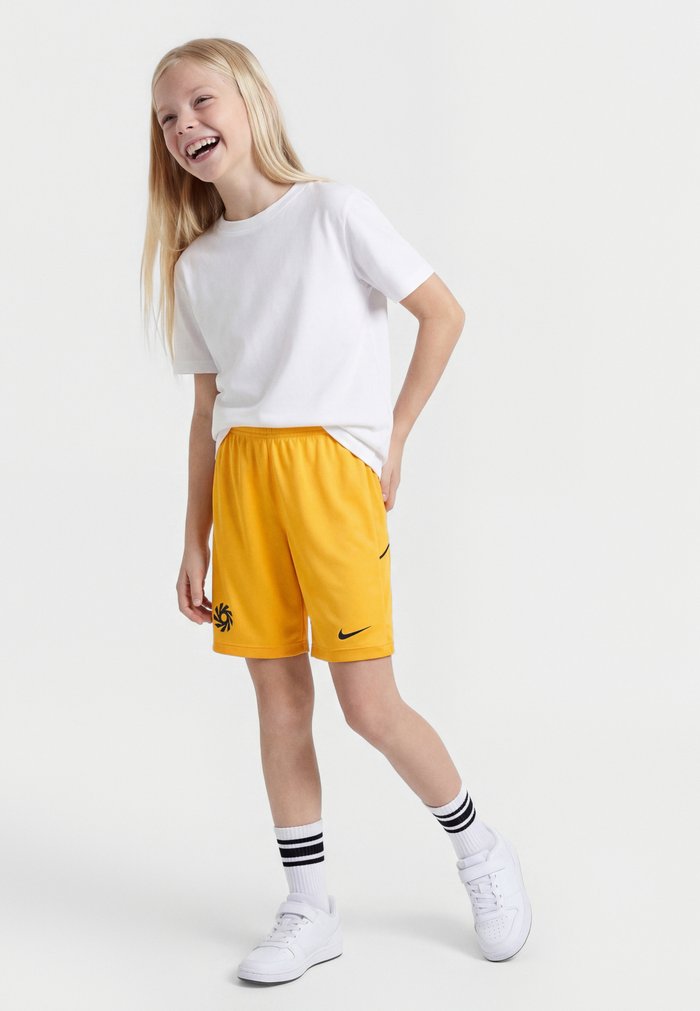 Nike ERLING HAALAND UNISEX - Pantalón corto de deporte - university gold-coloured/blue void