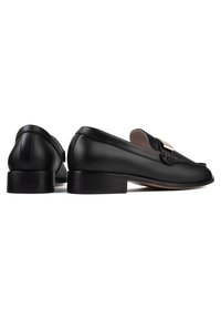 Black leather loafers with a rounded toe, flat heel, and braided detailing on the upper. Features a small gold hardware accent.