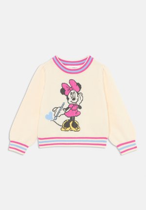Kremowy sweter z długim rękawem z różowo-niebieskimi prążkowymi mankietami i kołnierzem, przedstawiający Minnie Mouse w różowej sukience i dużą kokardą trzymającą balon w kształcie serca.