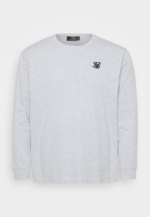Szara długorękawowa koszulka wykonana z miękkiej bawełny, z okrągłym dekoltem i małym czarnym logo wyszytym na lewej piersi.