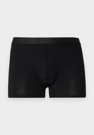 Black boxer shorts made of smooth fabric with a soft, elastic waistband and a fitted shape, featuring a front pouch for support.