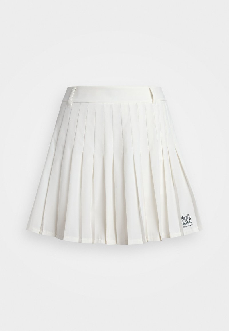 Hvid plisseret nederdel lavet af glat stof med en tætsiddende talje og broderet logo-detajle ved kanten.