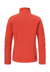 Rote Fleecejacke mit hohem Kragen, langen Ärmeln und gesteppten Details an den Nähten. Weicher Stoff und minimalistisches Design.