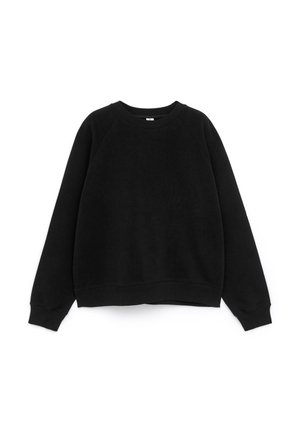 Black sweatshirt made of soft material, featuring a crew neck, long raglan sleeves, and ribbed cuffs with a slightly cropped hem.