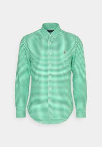 Zelená a bílá kostkovaná košile s dlouhým rukávem a límečkem na knoflíky, s zaobleným spodním okrajem a malým logem na hrudi.