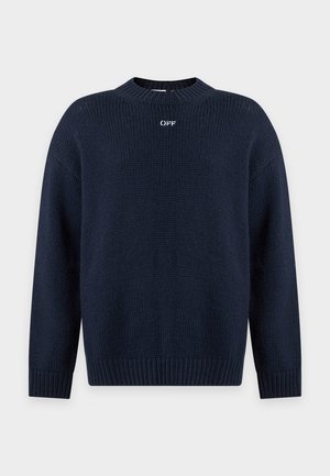 Jersey azul marino de punto con cuello redondo, mangas largas, puños y bajo acanalados, y un pequeño logo blanco en el pecho.