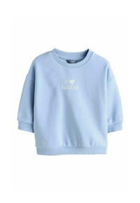 Sudadera azul claro hecha de material suave. Cuenta con un cuello redondo y mangas cortas. Texto decorativo "I ❤️ SNACKS" en blanco.