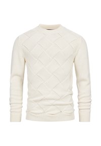 Maglione lavorato a maglia color crema con motivo a rombi, polsini e orlo a costine. Realizzato in morbido materiale con scollo rotondo.