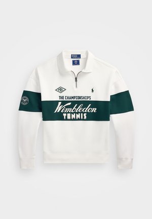 Hvit hettegenser med en grønn panel som har teksten "Wimbledon TENNIS", glidelås i halsen, lange ermer og broderte logo detaljer.