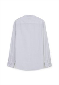 Camicia bianca a maniche lunghe realizzata in tessuto leggero, con un taglio dritto, polsini con bottoni e un dettaglio di yoke sul retro.