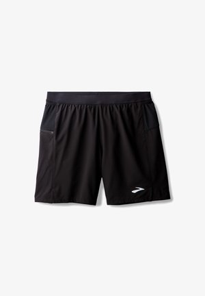 Schwarze Sportshorts aus leichtem Stoff, mit einem breiten Bund, zwei seitlichen Taschen und einem reflektierenden Logo an der Vorderseite unten.
