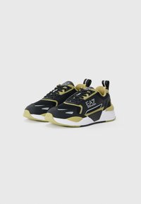 Black and olive green athletic sneakers with mesh upper, cushioned sole, contrasting white accents, and a pull tab on the heel.