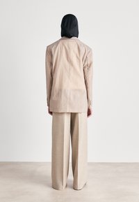 BOSS TAMAYA - Hlače - beige