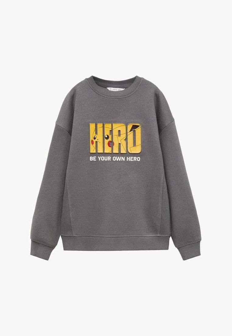 Felpa grigia con un grande grafico giallo "HERO" che mostra un personaggio dei cartoni e il testo "SII IL TUO EROE". Tessuto morbido e vestibilità rilassata.