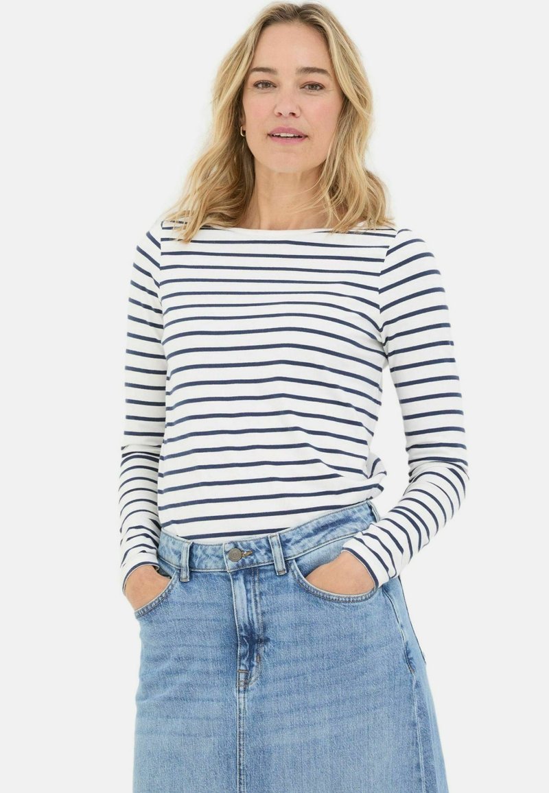 Long-sleeve striped shirt featuring navy and white horizontal lines, paired with a light blue denim skirt with a high waist.