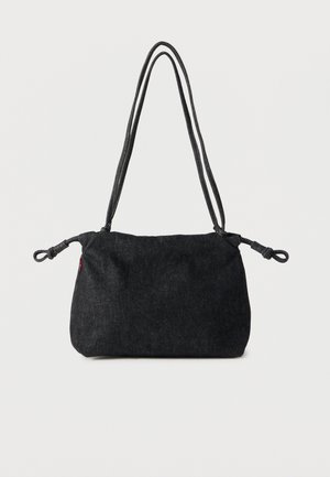 Black denim shoulder bag with double rope straps and knotted ends on each side, set against a plain white background.