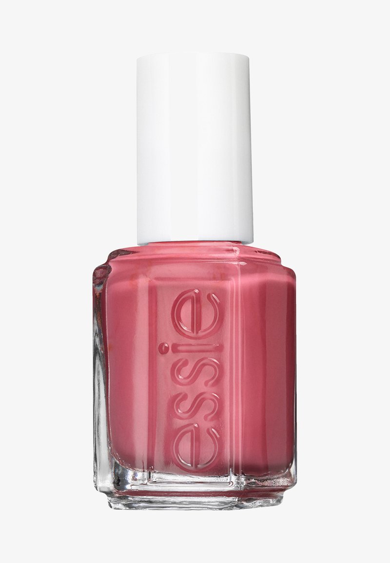 Bottiglia di smalto per unghie con una base quadrata in vetro trasparente e un tappo cilindrico bianco. Lo smalto è di un colore rosa morbido e lucido.