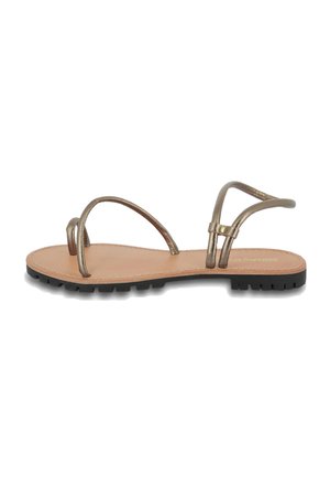Flat sandal with metallic bronze straps, beige leather insole, and black rubber outsole. Features minimalist design and adjustable buckle.