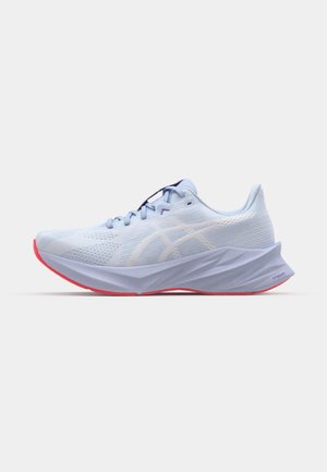 Light blue athletic shoe with a textured mesh upper, white logo accents, a cushioned sole, and a pink outsole. Features a sleek, ergonomic design.