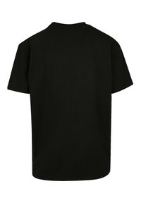 Black cotton t-shirt with short sleeves, crew neck, and a relaxed fit. Smooth texture, no visible patterns or accents.