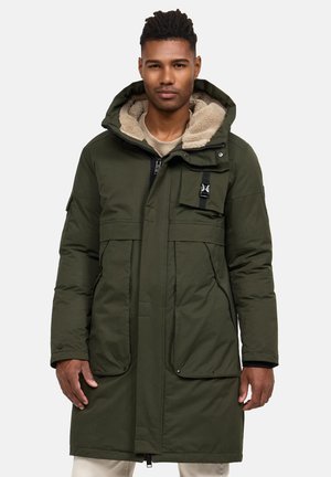 Olive green padded parka with a fur-lined hood, front zip closure, two large front pockets, and a chest pocket with hardware detail.