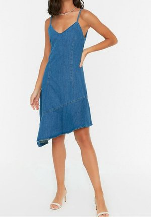 Denim dress with spaghetti straps, V-neckline, and asymmetrical hem. Light blue color, smooth texture, and visible stitching details.