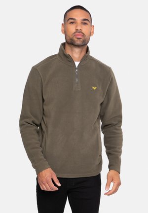Pulóver de forro polar verde oliva con cuello de media cremallera, mangas largas y un pequeño logotipo amarillo en el pecho. Textura suave y corte relajado.