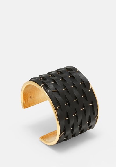 Black woven leather cuff bracelet with a gold-tone metal interior. Features a textured pattern and an open design for easy wear.