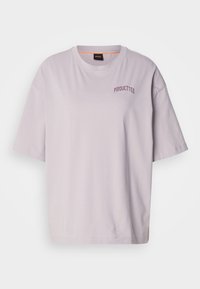 Light purple short-sleeve t-shirt made from soft fabric. Features relaxed fit with "PIROUETTES" embroidered in darker purple on the front.