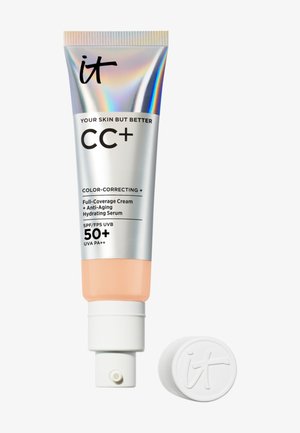 Tube de crème correctrice de couleur it Cosmetics CC+ avec SPF 50+ et sérum anti-âge, avec le bouchon retiré et placé à côté.