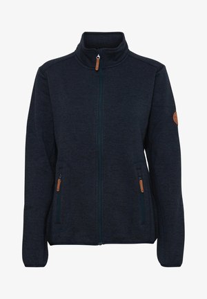 Veste en polaire bleu marine avec un col haut, une fermeture éclair à l'avant et deux poches zippées. Présente des accents en cuir beige sur les zippers et les manches.