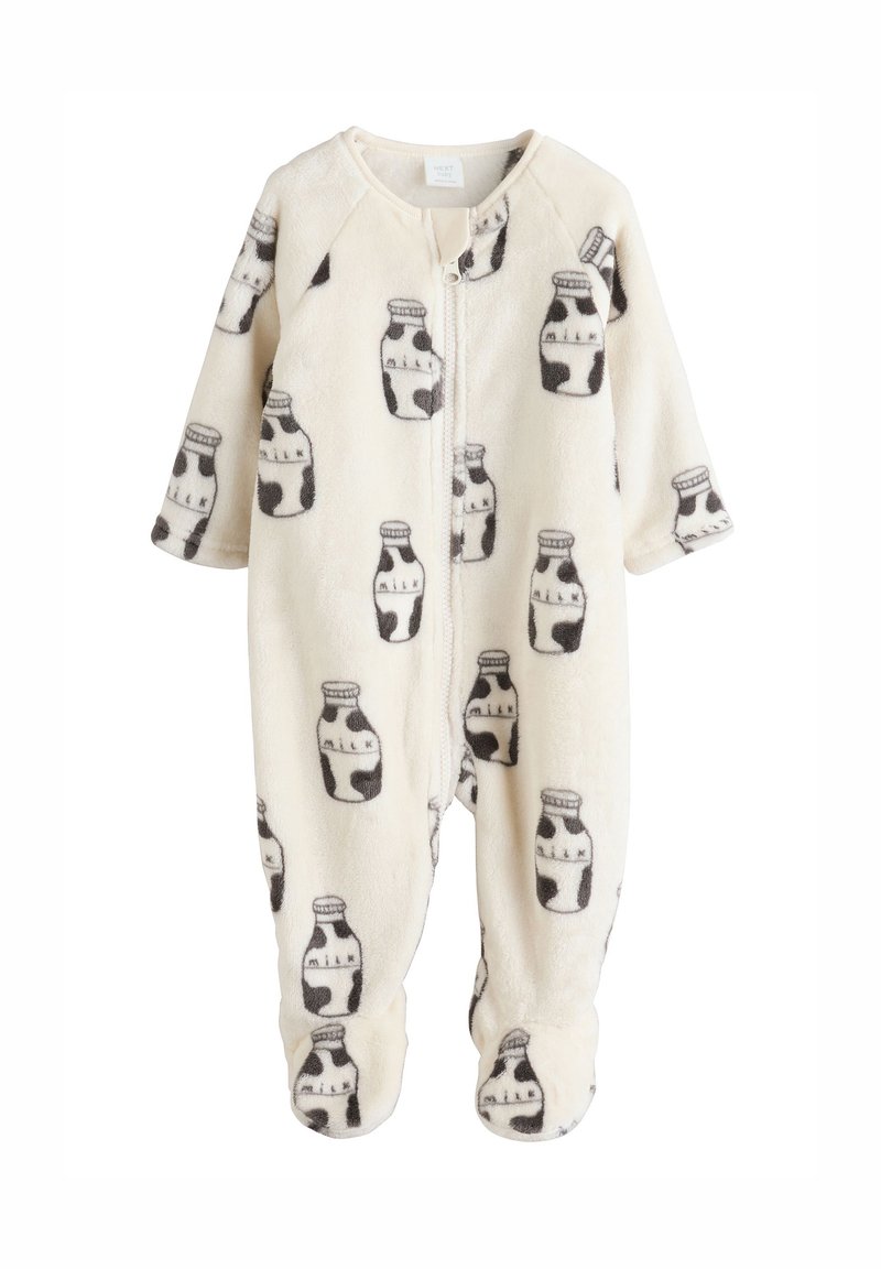 Combinaison bébé en polaire crème avec imprimé bouteilles de lait grises, manches longues, fermeture éclair et pieds intégrés pour plus de chaleur. Texture douce.