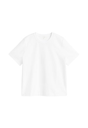 T-shirt blanc uni à manches courtes et col rond exposé sur un fond blanc, montrant la vue de face et des détails de couture minimaux.