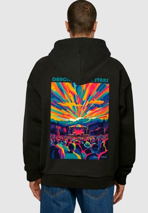 Black hoodie featuring a vibrant graphic print of a concert, with colorful rays, silhouettes of people, and a stage backdrop. Text reads "Dancing with Stars."