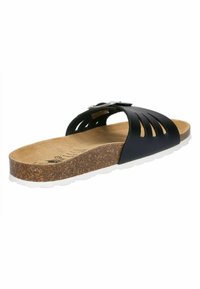 Black slide sandal with cut-out design, cork footbed, and textured rubber sole. Features a silver buckle accent for adjustable fit.