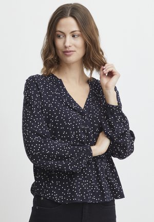 Marinebluse aus leichtem Material, mit V-Ausschnitt, langen Ballonärmeln und weißem Punktemuster. Lässige Passform und geraffte Manschetten.