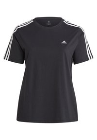 Svart t-shirt av mjukt tyg med vita tre-randsdetaljer på axlarna och en liten Adidas-logotyp framtill. Rund halsringning.