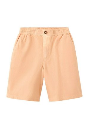 Shorts décontractés de couleur pêche clair avec une ceinture élastique, une fermeture à bouton et des poches latérales, présentés sur un fond blanc.