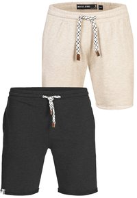 To sæt shorts: et beige og et sort. Begge har elastiske taljer med hvide snore med sorte mønstre og brune detaljer.