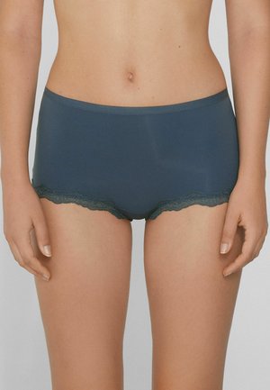 Dunkelblaue Hipster-Unterhosen aus weichem Stoff, mit einer gewellten Spitze an den Beinöffnungen für zusätzliche Details.