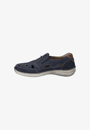 Marineblaue Lederschuhe mit Ausschnitten, elastischen Seitenbändern und beige genähten Akzenten. Sie verfügen über eine abgerundete Zehenpartie und eine leichte, flexible Sohle.