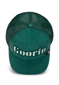 Green trucker hat with a fabric front and mesh back, featuring "Goorin" in white embroidered letters on the front. Flat brim design.